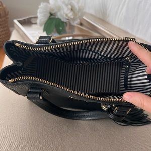 Kate spade black leather.Black/ white stripe inside. Used Great condition.